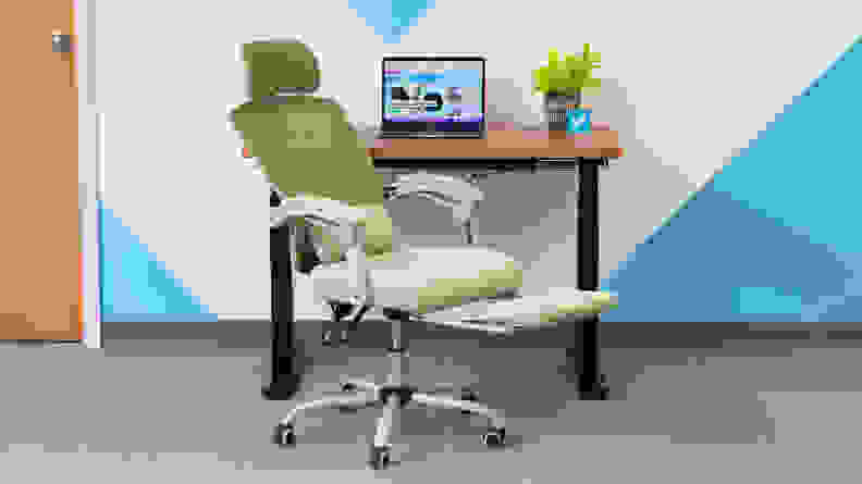 Green Edx Reclining Office Chair in front of desk with laptop computer.