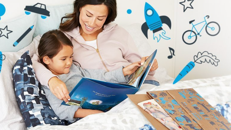 Woman reading a picture book to a small boy in bed.