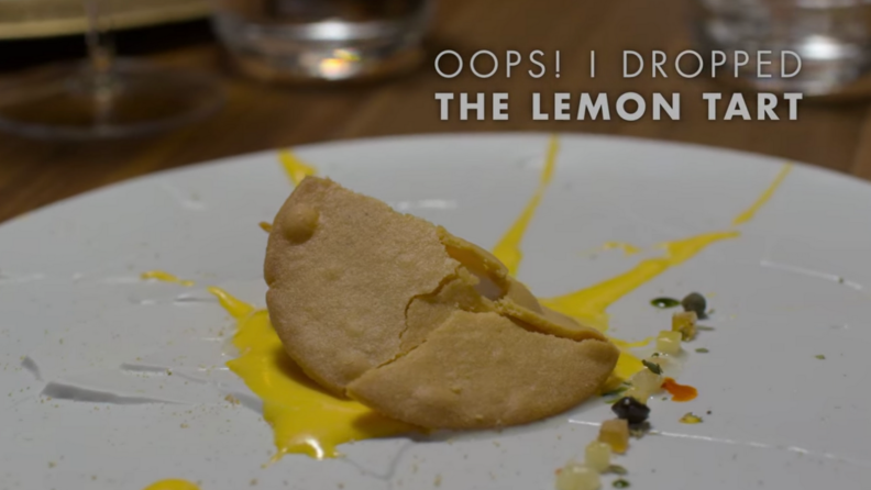An image of the signature Oops I Dropped the Lemon Tart dish from Osteria Francescana.