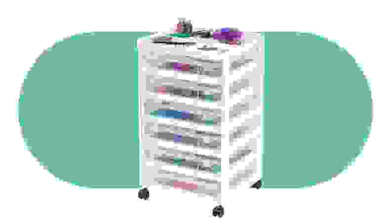 The Iris rolling cart in white with multiple draws on a green background.