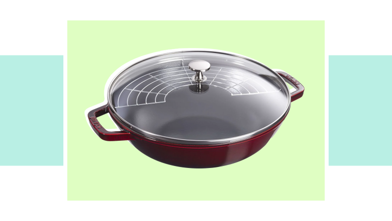 An image of a red Staub Perfect Pan with a glass lid.