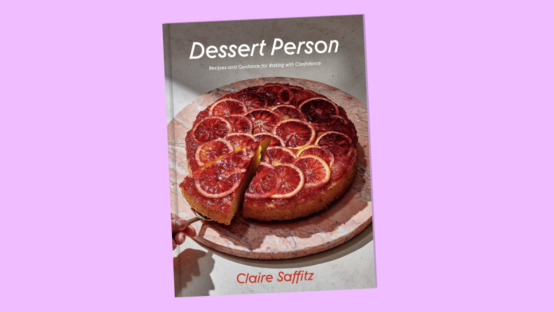"Dessert Person: Recipes and Guidance for Baking with Confidence” by Claire Saffitz book on a magenta background.
