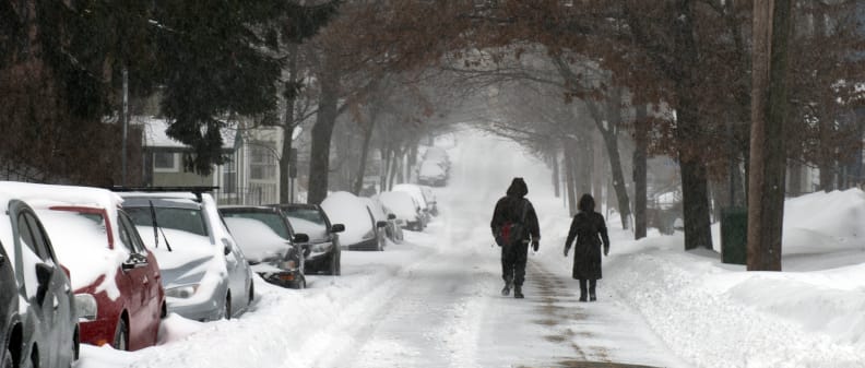 A photo of a walking couple taken during winter storm Juno.