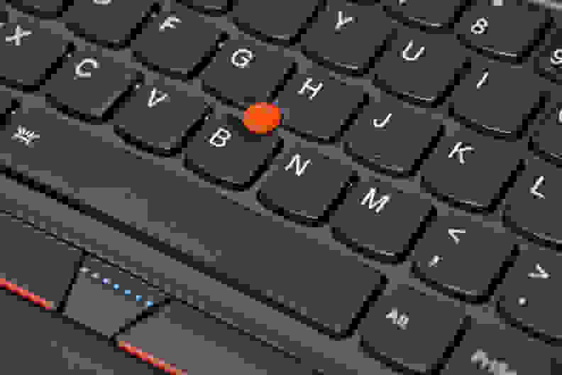 In the center of the keyboard is a red button that can be used to control the mouse.