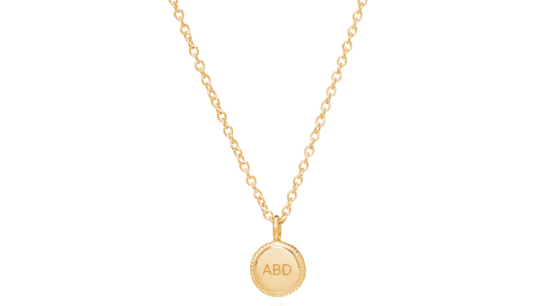 monogrammed necklaces on white background
