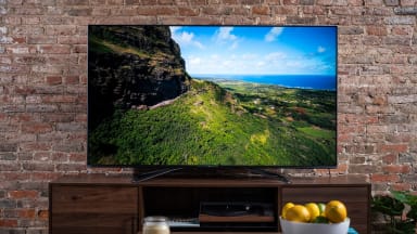 The 65-inch Hisense U8G displaying 4K/HDR content in a living room setting