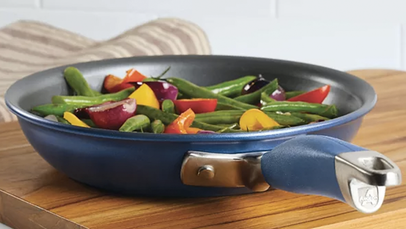 A blue skillet full of veggies