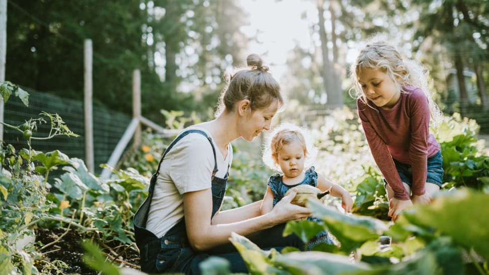 Mother in garden with two kids