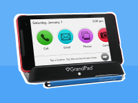 Grandpad Accesibility tablet displaying call, email, phone and camera functions on screen.