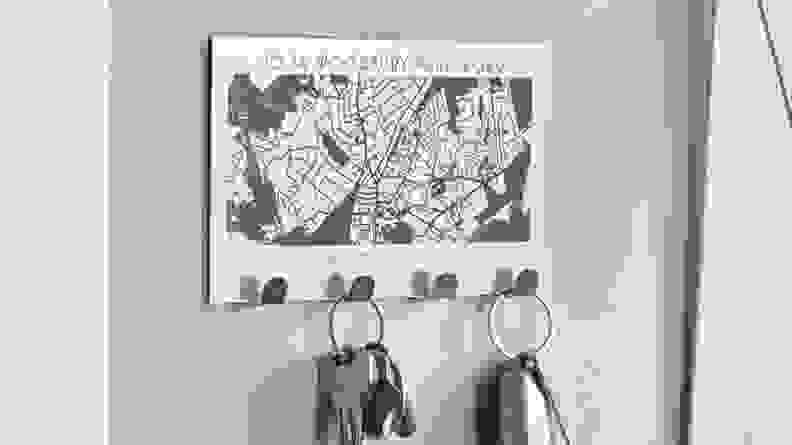 This family-sized key holder has a laser-engraved map of their new neighborhood.