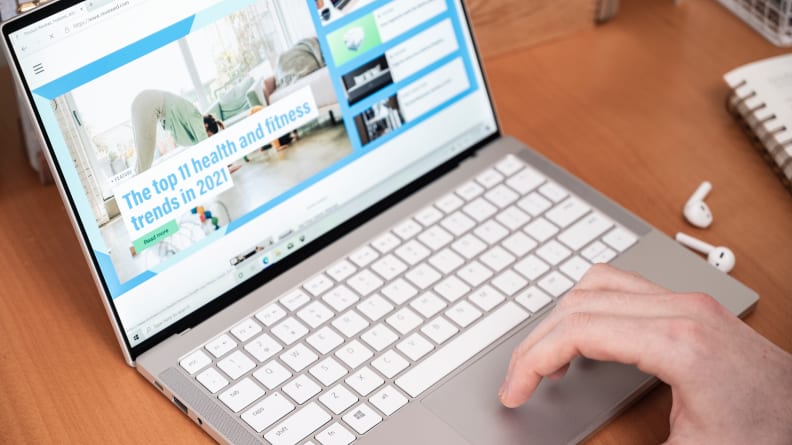 A person uses the trackpad