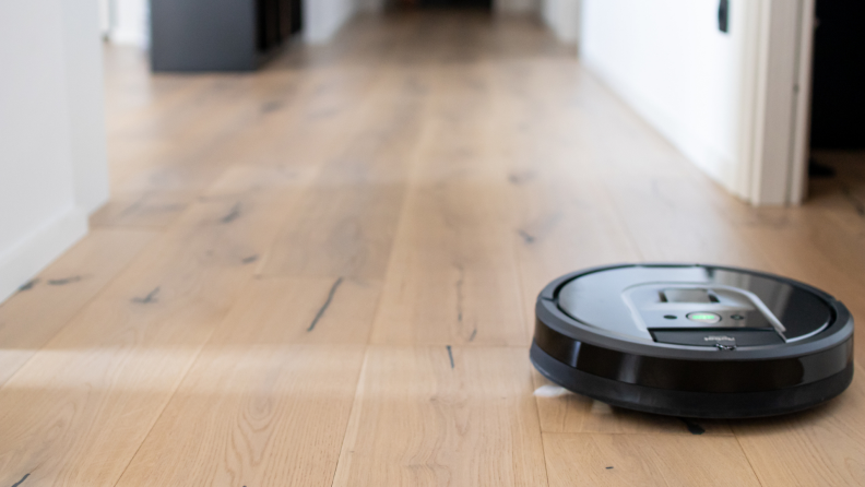Robot vacuum cleaning hardwood floors.