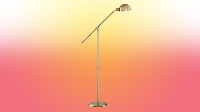 A lamp stands on a red and yellow fade background