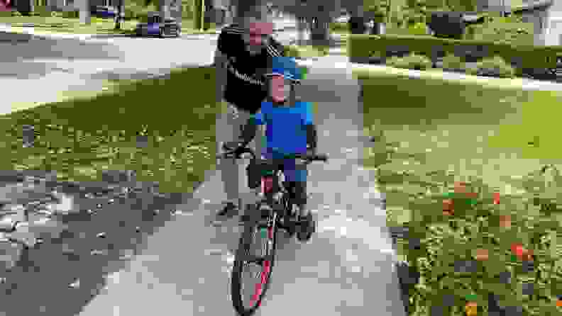 A boy learning to ride a Guardian Kids Bike