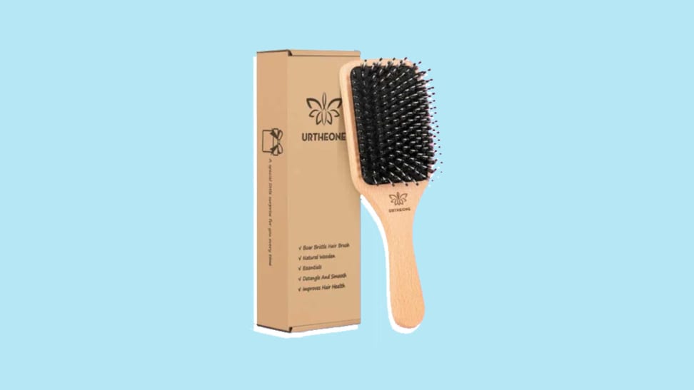 A hairbrush and comb next to a brown, rectangle box on a blue and purple background.