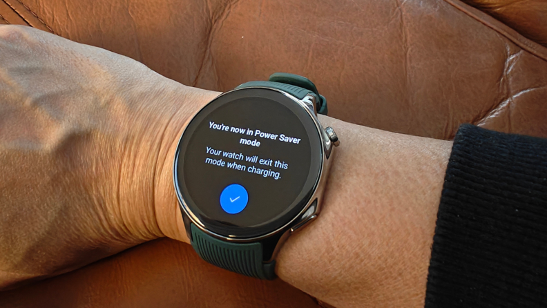 A OnePlus Watch 2 on a wrist with Power Saver mode enabled.