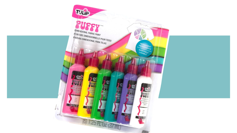 Bottles of Tulip puff paint in 6 different colors on a colorful background