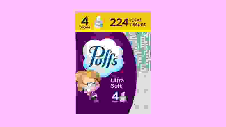 A purple package of Puffs Ultra Soft on a purple background.