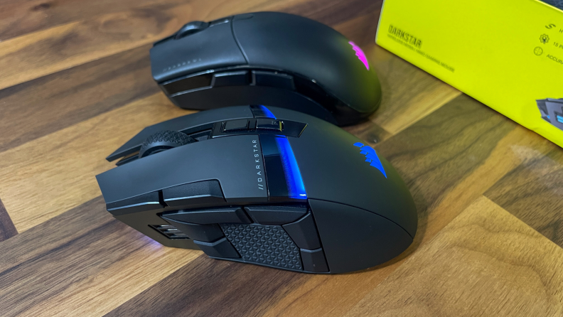 Two Corsair Darkstar mouses in the color black side-by-side.