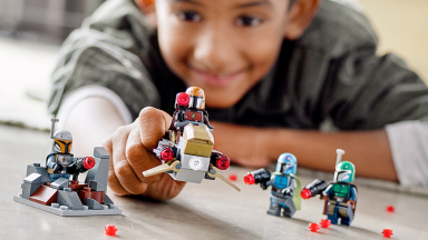 Boy playing with lego figures
