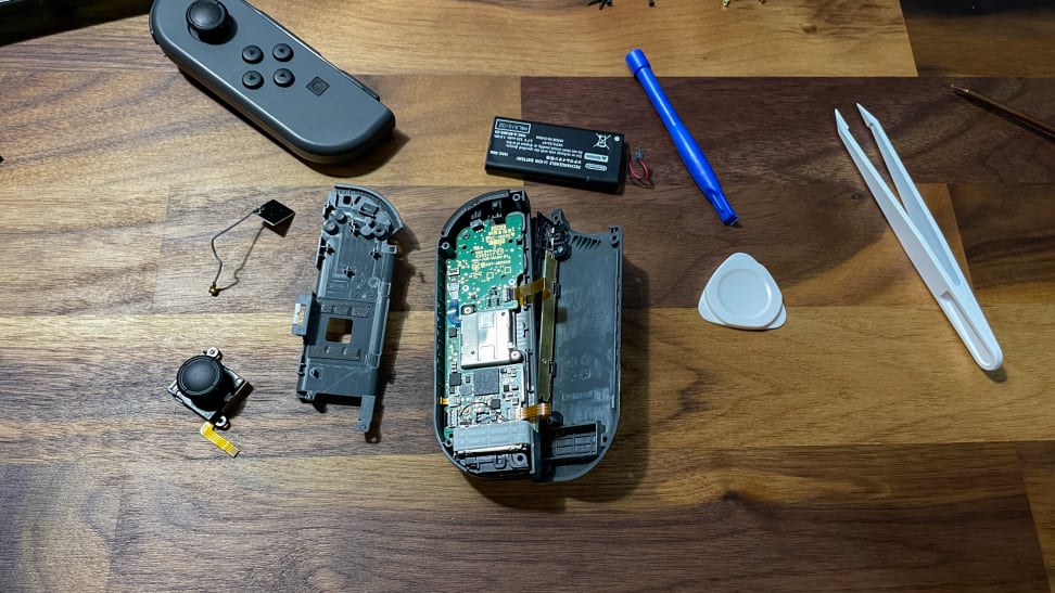 The Nintendo Switch Joycon opened and being worked on.