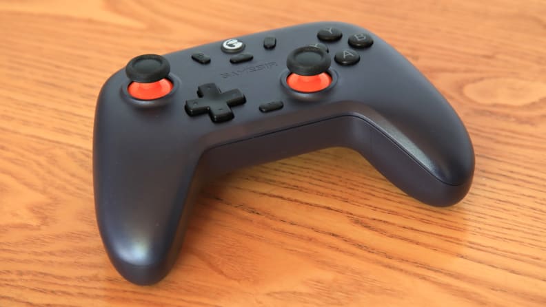 The gamesir nova lite, the value pick for best PC controllers you can buy right now, on a wooden table