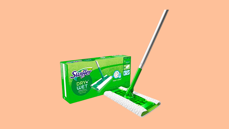 Swiffer mop against a peach background