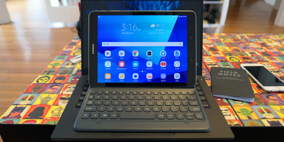 Samsung Galaxy Tab S3 on top of laptop