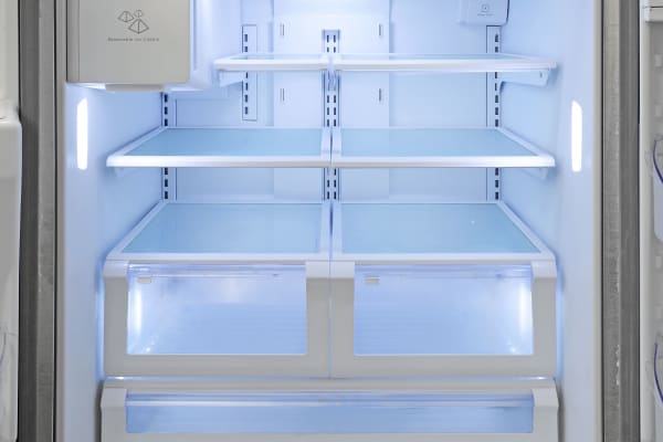 No bells and whistles here—just standard adjustable shelves and sliding drawers inside the Kenmore 70343's fridge.
