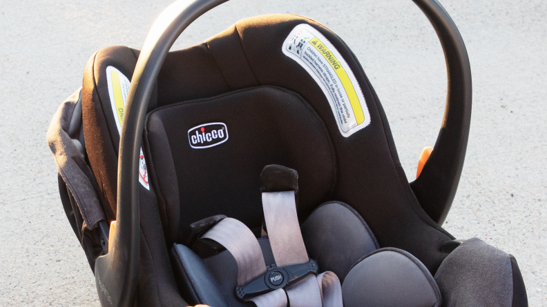 The Chicco KeyFit 35 car seat with the handle up.