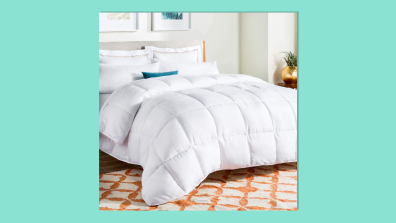 Linenspa All-Season down alternative quilted comforter on light green background.