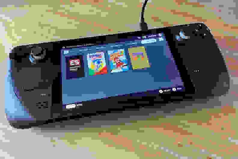 Thumbnail images showing on the screen of black handheld gaming console