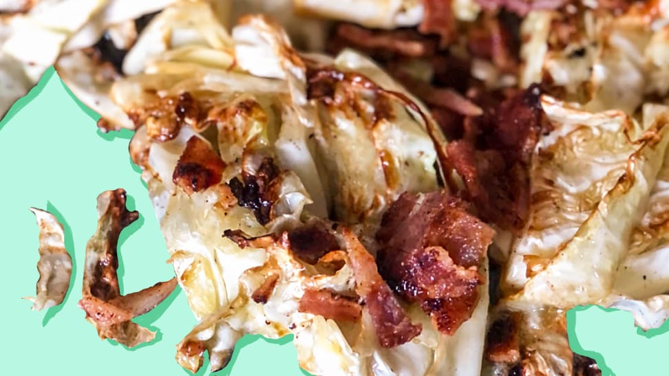A close-up of grilled cabbage with crispy bacon.