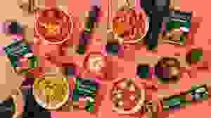 Banza new brown rice pasta dishes on pink background