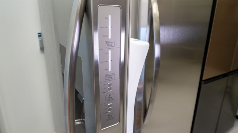 Side control panels on the stainless steel Frigidaire FRSS2623AS side-by-side.