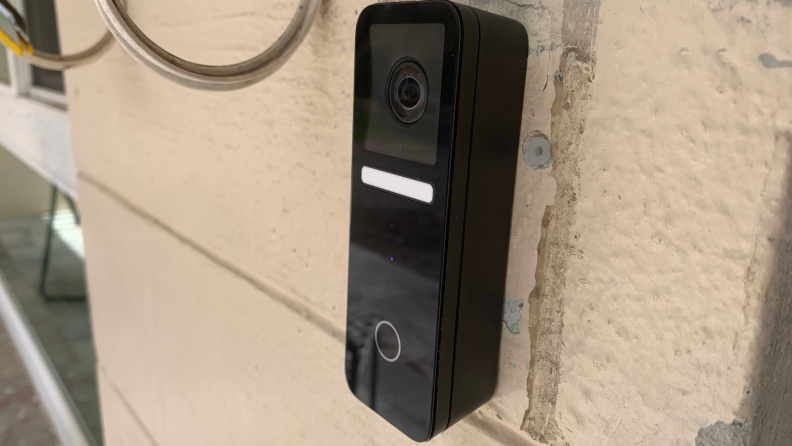 The Logitech Circle View Doorbell Wired on the front of a house.