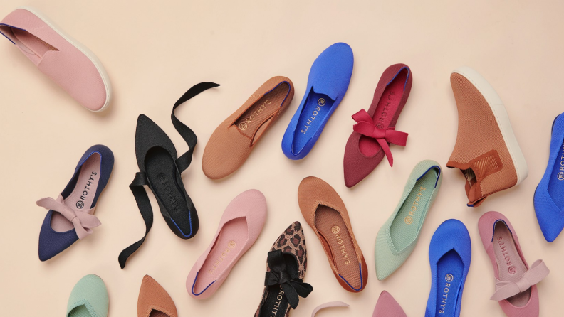 Colorful shoes spread on the floor.