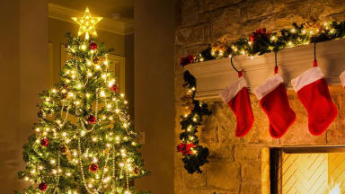 A star tree topper on top of a family's Christmas tree.