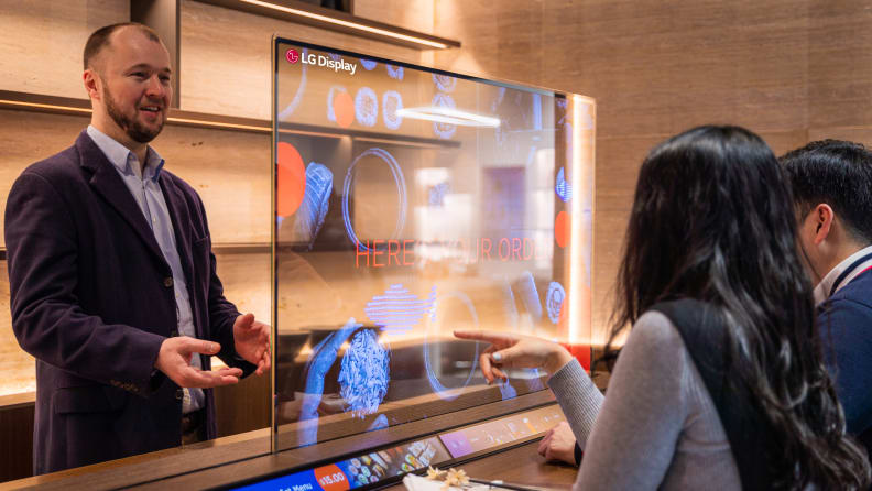 LG demonstrating how its transparent OLED can be used in a business setting, like restaurants