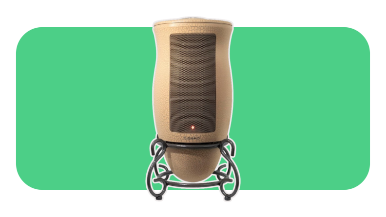 A brown Lasko 6435 space heater on a green background.