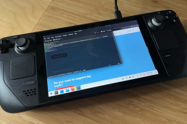A pop-up with lots of text showing on the screen of black handheld gaming console