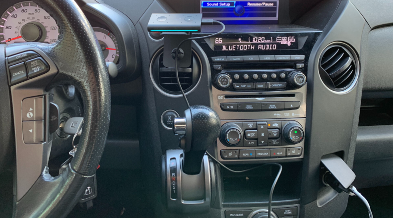 The Echo Auto is pictured inside of a Honda Pilot.