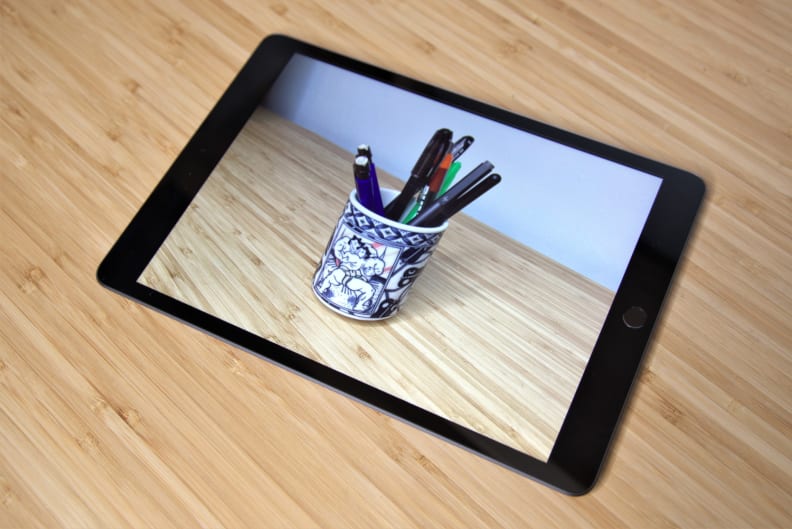 An Apple iPad used to display a photo.