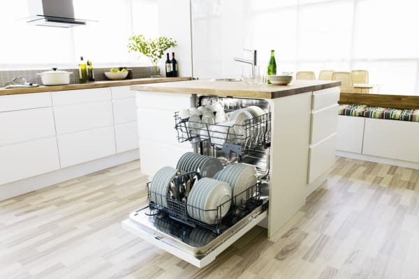 A fully integrated Asko dishwasher in the island of a transitional kitchen design.