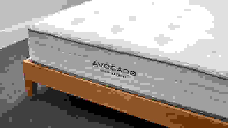 The Avocado mattress on a brown bed frame