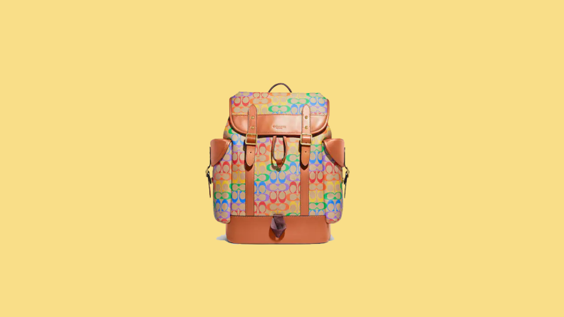 rainbow printed backpack on yellow background