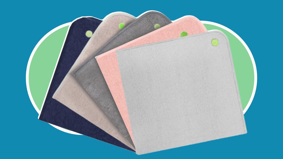 Product shot of five Peapod Mats in navy, tan, charcoal gray, pink and light gray colors.