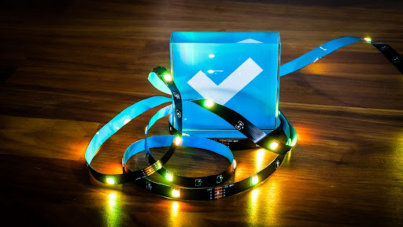 LED strip lights surrounding a glass paperweight