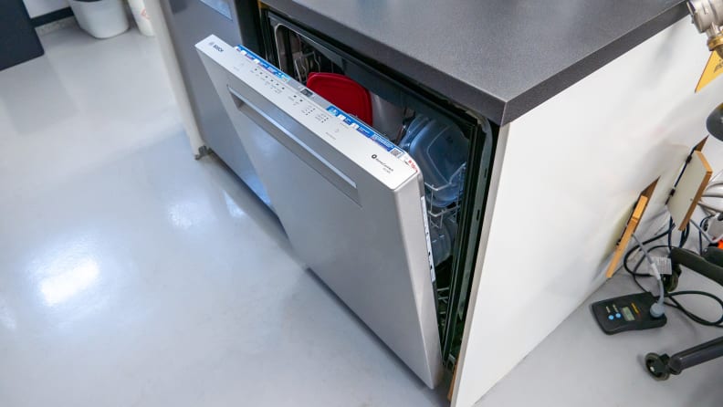 A close-up of a Bosch dishwasher in our testing labs, its door slightly open.