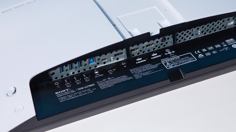 Close up of the connectivity ports on the underside of a computer monitor